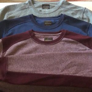 Three Greg Norman moisture wicking pull overs